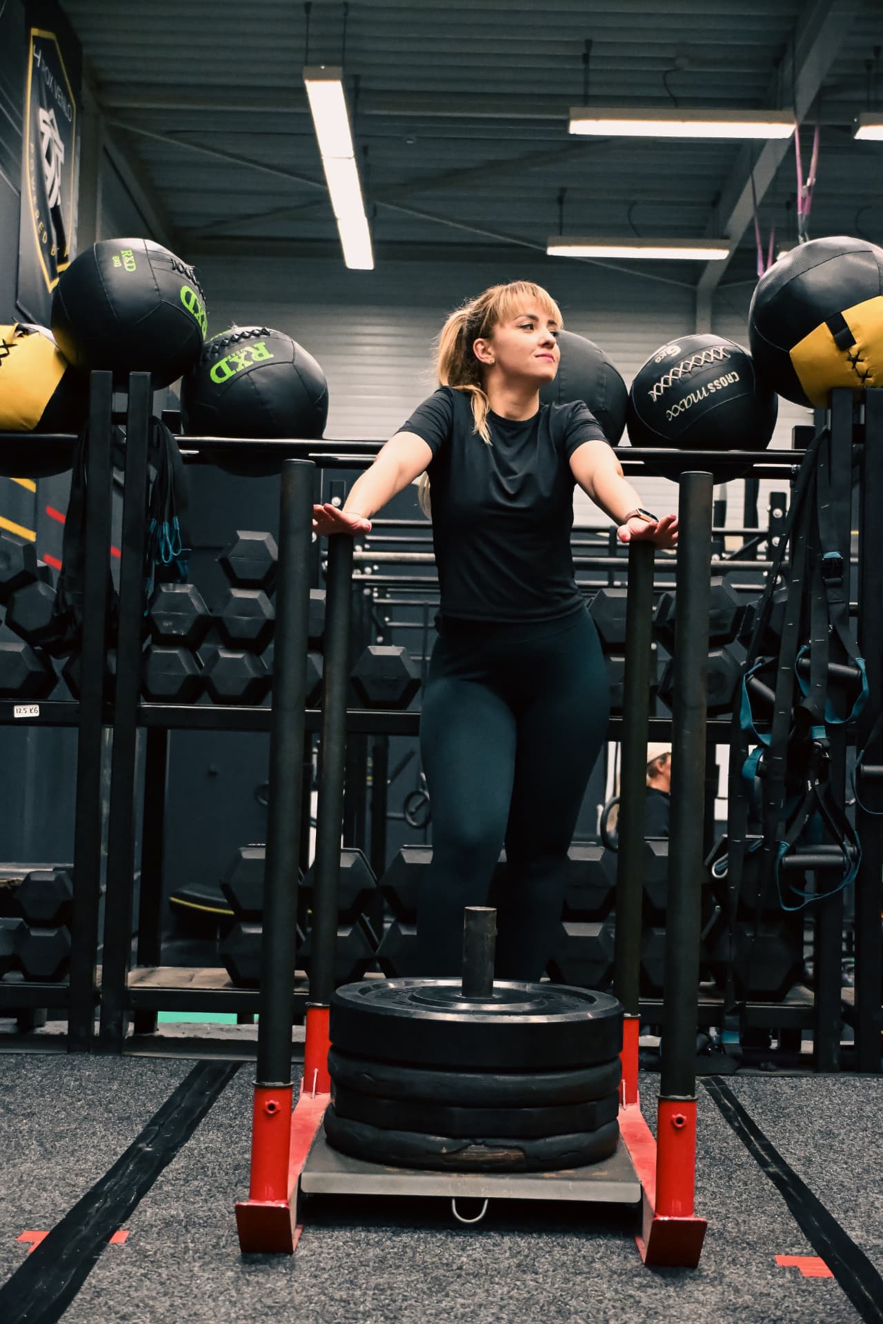 Athlete resting at the weighted sled between sets