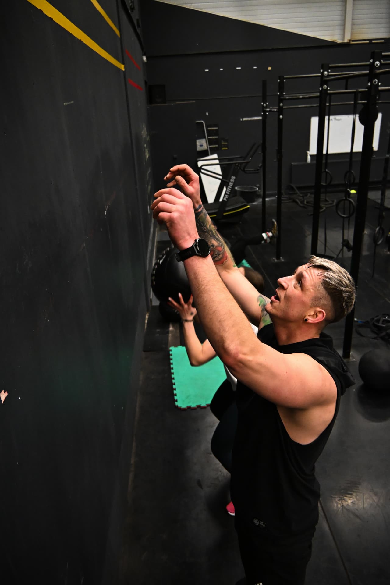 Athlete performing wall balls during training